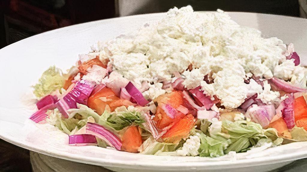 Greek Salad · Lettuce, tomatoes, cucumbers, olives & feta cheese.