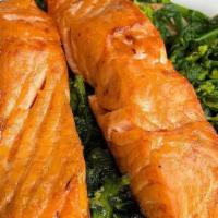 Grilled Salmon Over Brocoli Rabe · Served over broccoli rabe in garlic & oil.