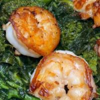 Grilled Shrimp Over Broccoli Rabe · Served over broccoli rabe in garlic & oil.