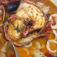 Seafood Combo · Lobster tails, scallops, shrimp, calamari, mussels & clams in a white wine marinara.