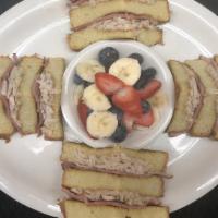 Monte Cristo Breakfast · Thick-sliced French toast with sliced turkey, ham and Swiss cheese. Served with fruit salad....