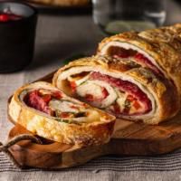 Stromboli With Meatballs And Garlic · Italian turnover made with Pizza Dough and filled with mozzarella cheese and topped with mea...