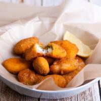 Cheddar Jalapeño  Poppers · Juicy jalapeño poppers breaded and filled with cheese and fried to golden perfection.