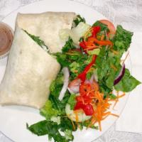 Chicken Caesar Wrap · Grilled chicken tossed with romaine lettuce and Caesar dressing.