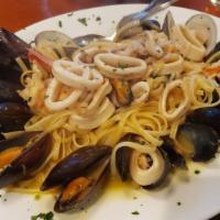 Zuppa Di Pesce · Shrimp, clams, mussels and calamari in a marechiare sauce over linguini.