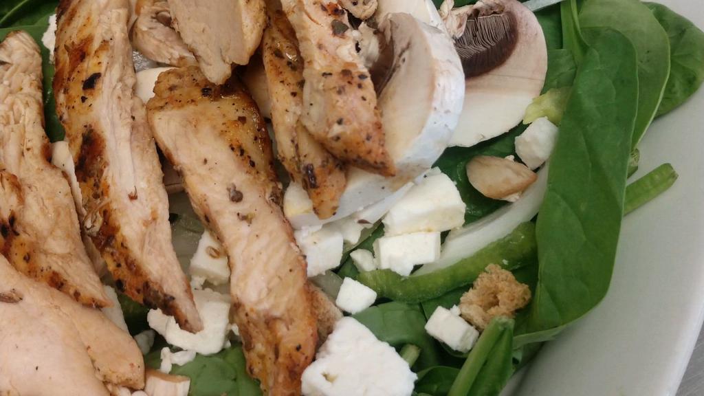 Spinach Salad · With char-broiled, or blackened chicken, roasted red peppers, cheese, croutons, bacon and house dressing.