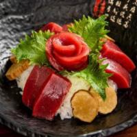 Sashimi Donburi · Rice bowl topped with thin-sliced sashimi. Choice of tuna, salmon or yellowtail 
served with...