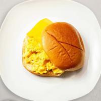 The Breakfast Egg Sandwich · Fresh sizzling eggs on bread with additional toppings.