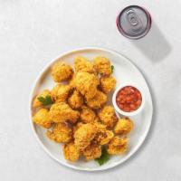 Chicken Popcorn · Bite-size pieces of chicken breaded and fried until golden brown.