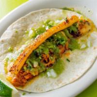 Gringa Taco · Al Pastor on a flour tortilla, mixed with melted cheese and grilled pineapple. Mama's favori...