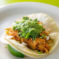 Tinga Taco · Shredded chicken breast marinated with chipotle tomato and onion.