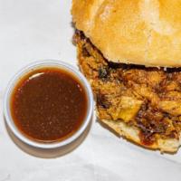 Pulled Pork Sandwich · Our multiple award winning hickory smoked pulled pork shoulder.  We serve this on a kaiser r...