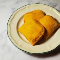 Beef Pattie · Jamaican patty filled with beef and spices with a flaky shell.