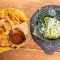 Classic Guacamole · Cilantro, lime, onion, jalapeño
& cotija cheese.