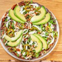 Black Bean Tlayuda · Crispy corn flatbread topped with refried black beans, oaxaca cheese, avocado,
jalapeño, let...