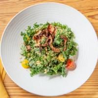Kale Caesar Salad · Vegan caesar dressing, grape tomatoes, crispy shiitake mushrooms & cashew “parmesan”.