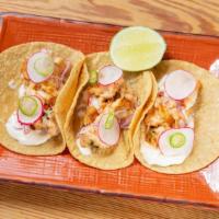 Shrimp Taco · Cascabel chile, crispy potato, creamy queso mixto, rosemary, roasted cherry tomatoes.