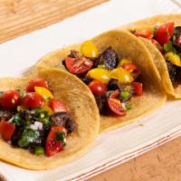 Steak Tacos · Grilled skirt steak, cherry tomato pico de gallo & salsa taquera.