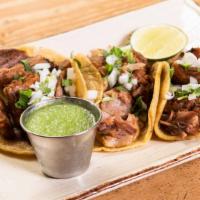 Carnitas Tacos · Tender pork belly & shoulder with salsa verde.