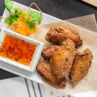 Fried Chicken Wings · Five pieces. Seasoned mid wings served with spicy tamarind sauce.
