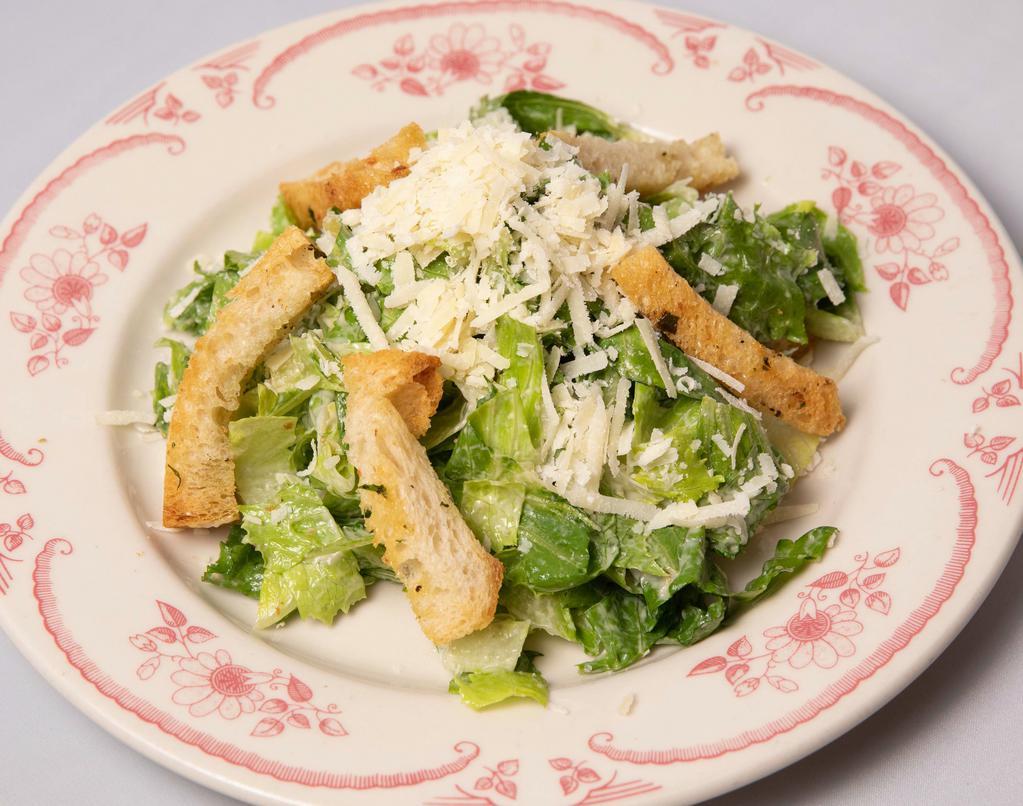 Insalata Caesar · Toasted bread, lettuce, parmesan with anchovies capers garlic dressing