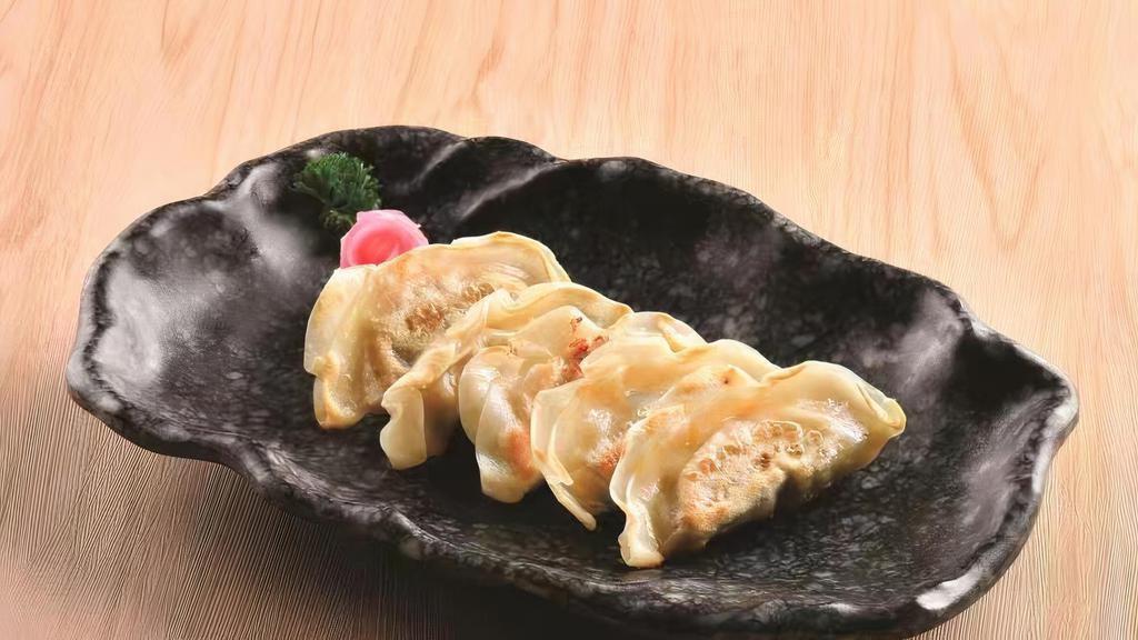 Gyoza (Shrimp Or Pork) · Japanese style pan fried dumpling.