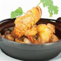 Fire Wok · Spicy. Prawn, lobster tail, sea scallops, jumbo shrimp, garden vegetable with Thai curry.