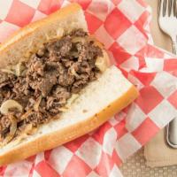 Philly Cheese Steak · Sliced marinated rib-eye, onions & provolone cheese.
