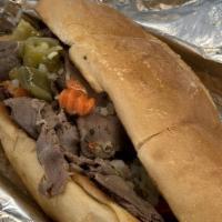 Chicago Mike'S Italian Beef With Cheddar Cheese · Beef sandwiches on italian bread with your choice of spicy giardiniera or grilled peppers.