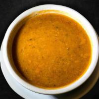 Red Lentil Soup · Red lentil, finely chopped onions, tomato paste, olive oil and dried crushed mint leaves.