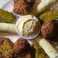 Istanbul Sampler · Includes three pieces of cheese rolls, three pieces of falafel, three pieces of stuffed grap...