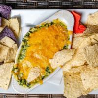 Spinach & Artichoke Dip · House-Made, Warm Creamy Spinach & Artichoke Hearts, Cheddar Cheese, Crispy Tortilla Chips