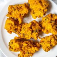 Asoorted Pakora (5) · Fresh vegetables dipped in a special spiced batter and fried to golden perfection, served wi...