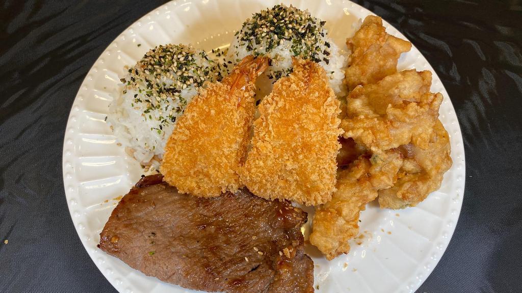 Oh My Pac · 2 fried shrimps, beef, mochiko, and chicken with nori furikake. Choose your rice & salad.