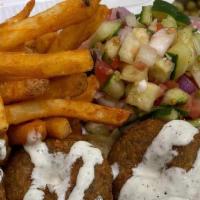 Falafel Over Rice · Most popular. fresh homemade falafel platter includes rice, salad and fries or hummus your c...