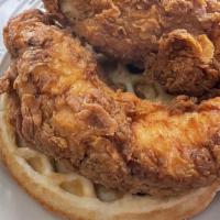 Joker'S Chicken & Waffles · Three hand breaded chicken tenders over our sweet or savory style waffles, smothered in a ch...