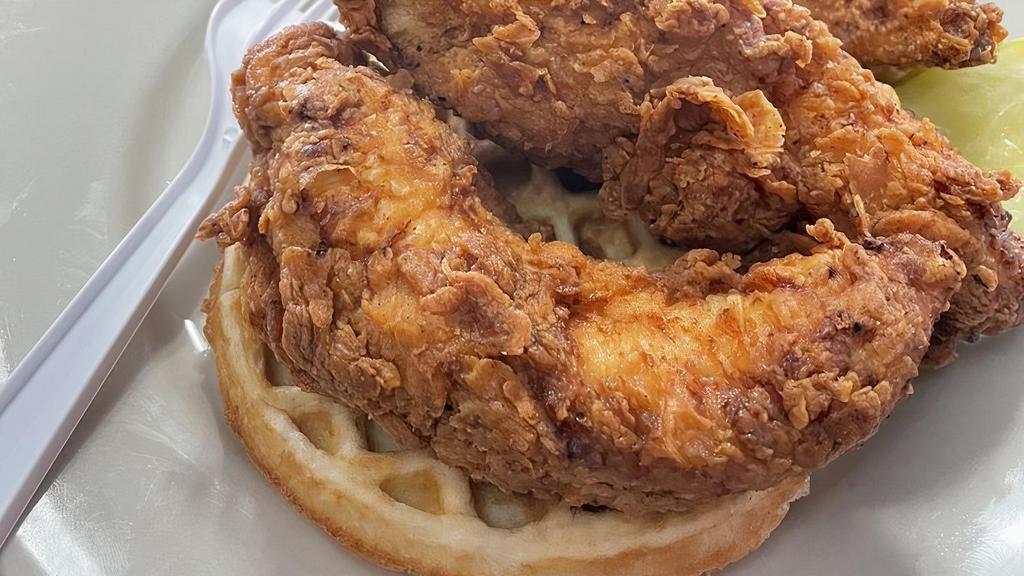 Joker'S Chicken & Waffles · Three hand breaded chicken tenders over our sweet or savory style waffles, smothered in a choice of our sweet, mild or hot signature syrup sauces.