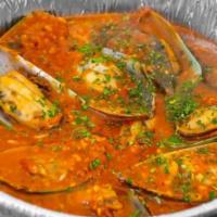 Mussels Marinara · Sweet and rich mussels cooked in a tomato sauce.