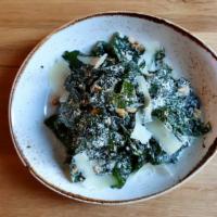 Kale Caesar  · Calabrian chiles, pine nuts, parmesan.