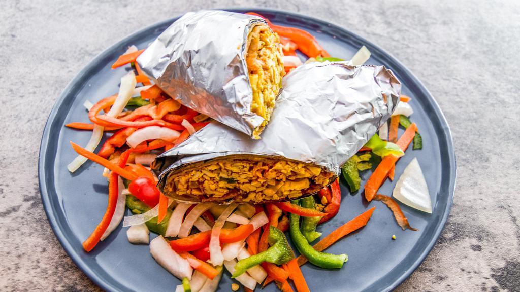Paneer Wrap · Paneer grilled in the tandoor along with grilled veggies that are crisp to the bite. Along with this goes a tangy green chutney and white sauce. Paratha or wrap is made with whole wheat dough. Overall providing a healthy and delicious bite to savor.