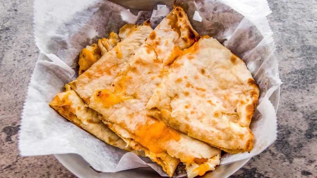 Naan · Naan is an unleavened flatbread that is made using by a mix of whole wheat flour and all-purpose flour and baked in a Clay Oven.