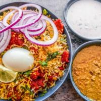 Chicken Biryani · Rice is slowly cooked over alternating layers of gravy, infused with spice and herbs to give...