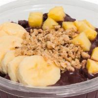 Tropical Acai Bowl · Base blend: acai, cream of coconut, blueberries, banana. Topped with: granola, banana and pi...