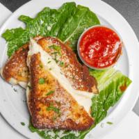Mozzarella In Carrozza · Our homemade fresh mozzarella coated with our seasoned italian bread crumbs and pan fried.