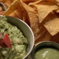 Traditional Guac · Hass avocado, red onion, cilantro, habanero chillis, corn totopos.