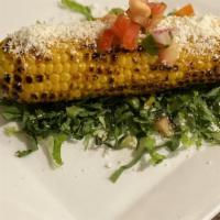 Elote · Corn on the cob with cotija cheese and chipotle lime butter.