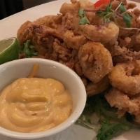 Corn Crusted Calamari · Beer battered, served with chipotle aioli.