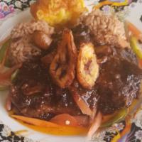 Oxtail · Served with rice and peas or white rice  with steam vegetables