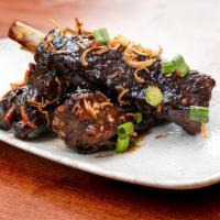 Sticky Ribs · Slow roasted ribs w. fried onion, scallion, sesame seeds in house-made sticky rib sauce. 1/2...