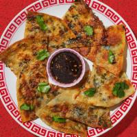 Scallion Pancakes · Pan-fried pancakes made with flavorful green onions.
